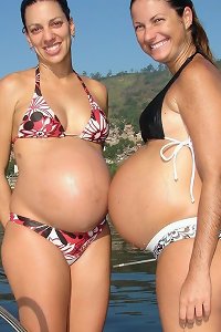 voluptuous woman rubbing her enormous breasts temptingly